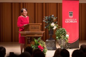Mary Frances Early speaking at a podium at UGA