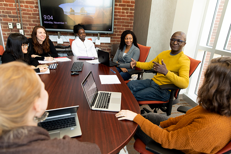 Mentor and mentees in a classroom