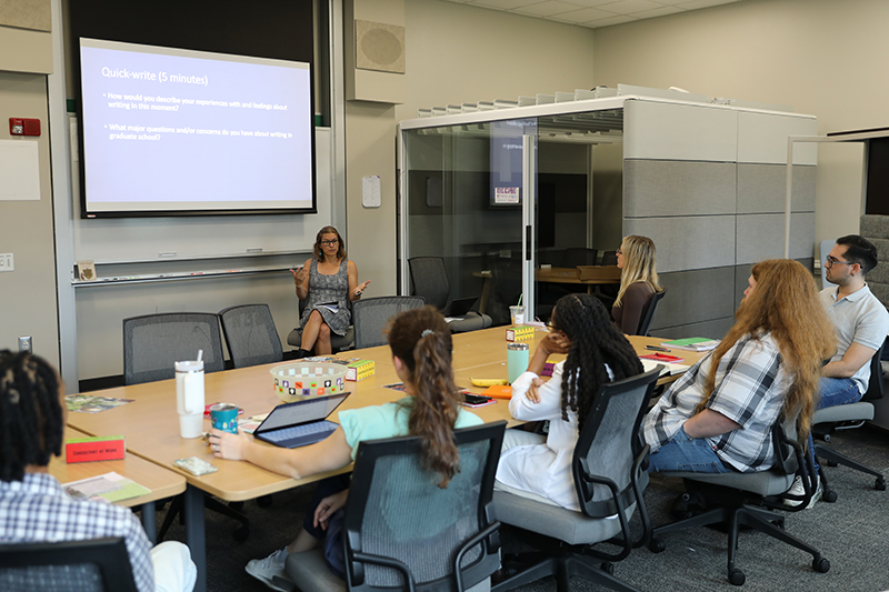 Gateway Bootcamp group of students listening to a presentation from a campus partner